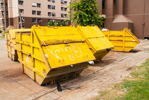 Service vehicle delivering a skip in Leyton